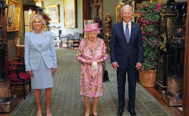 WINDSOR, ENGLAND - JUNE 13: Queen Elizabeth II (C) with US President Joe Biden and First Lady Jill Biden in the Grand Corridor during their visit to Windsor Castle on June 13, 2021 in Windsor, England. Queen Elizabeth II hosts US President, Joe Biden and First Lady Dr Jill Biden at Windsor Castle. The President arrived from Cornwall where he attended the G7 Leader's Summit and will travel on to Brussels for a meeting of NATO Allies and later in the week he will meet President of Russia, Vladimir Putin. (Photo by Steve Parsons - WPA Pool/Getty Images)